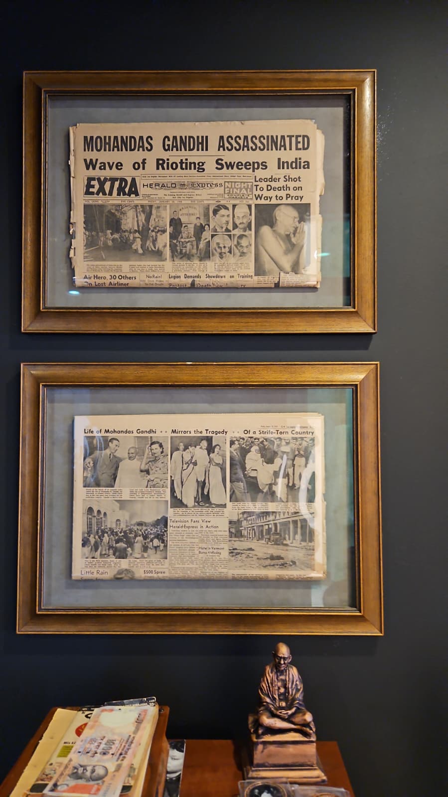 Front pages of the Herald-Express EXTRA edition of January 30, 1948 announcing Gandhi's assassination, in museum archival frame