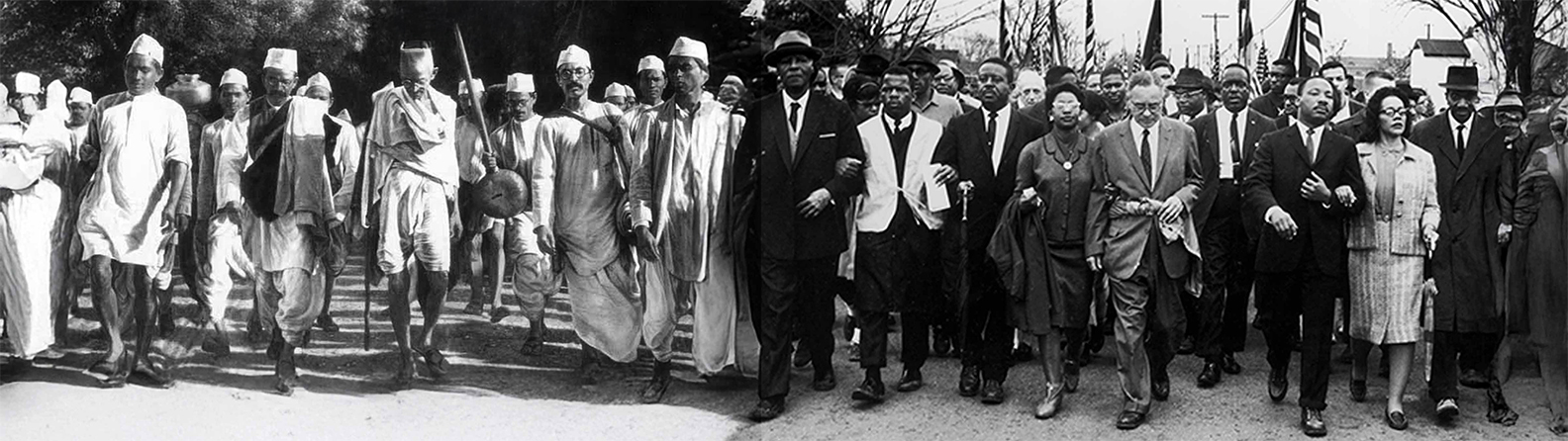 A panoramic composite of two archival photographs: Mahatma Gandhi leading marchers during the 1930 Salt March on the left, joined to Dr. Martin Luther King Jr. leading civil rights marchers on the right.