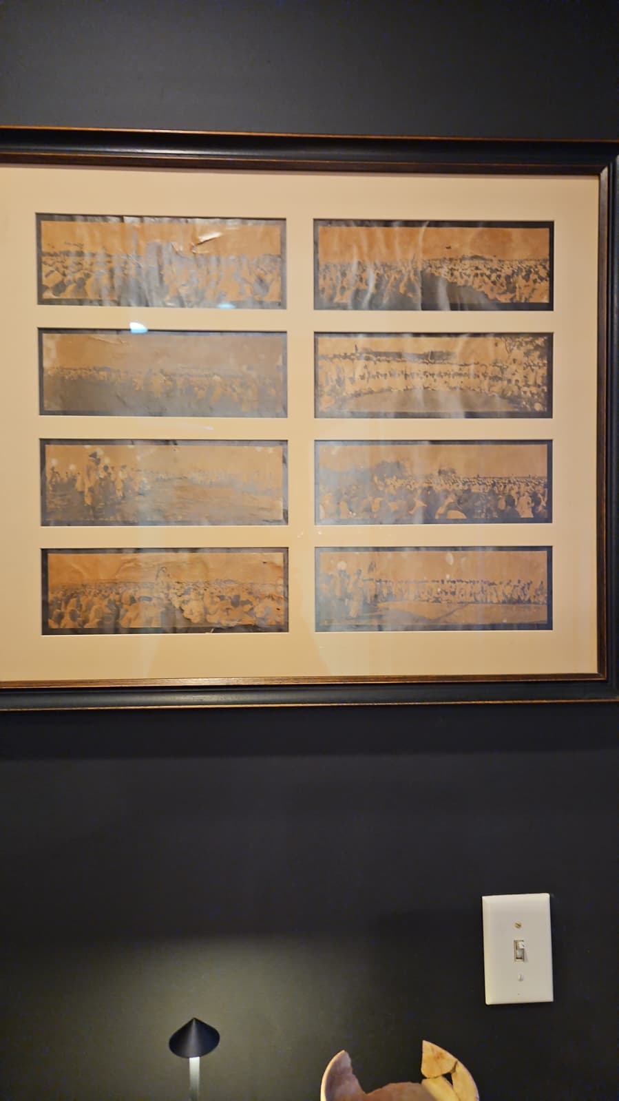 Eight panoramic Salt March photographs in a museum archival frame